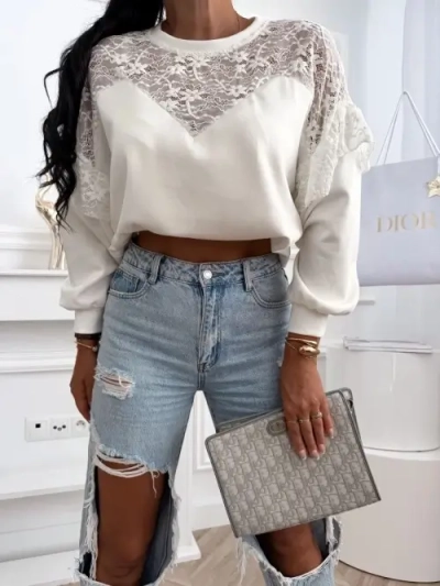 Bluzka damska oversize z koronką i falbaną Bluzka damska oversize z koronką i falbaną